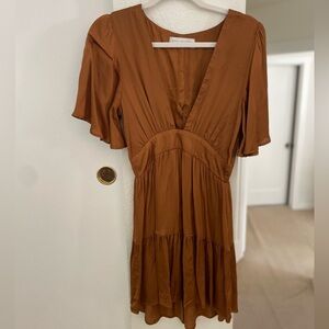 Saltwater silk “gold” dress with plunging neckline and zipper in the back.